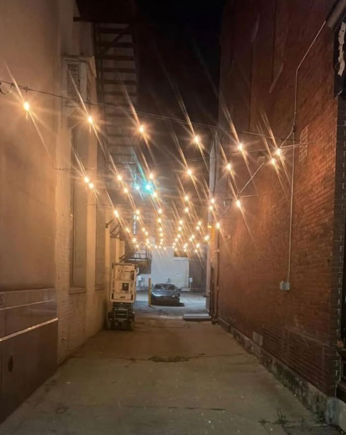 String lights lighting the alley beside Martha’s Exchange at night