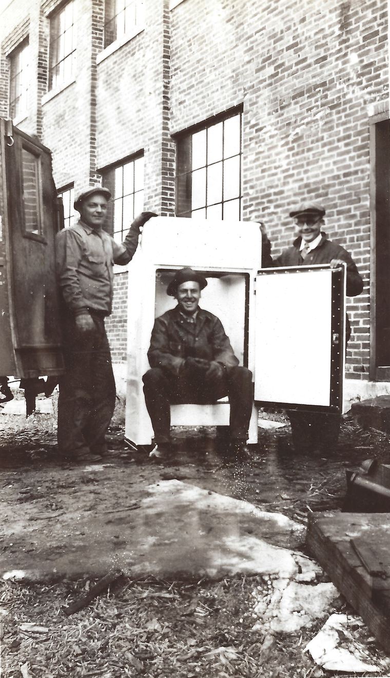 Johnson's Electric Shop crew with a new Westinghouse refrigerator, circa 1920
