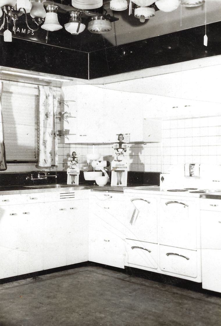 The model kitchen display on the shop floor with lamps overhead